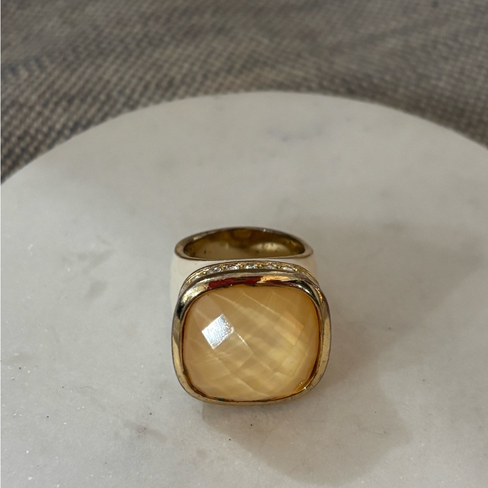 Elegant Gold and Cream Ring with Yellow Gemstone